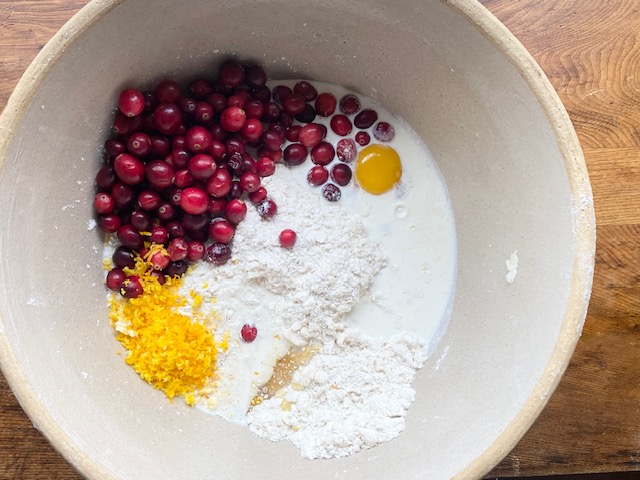 Gluten Free Cranberry Orange Scone Mixture In Tan Bowl