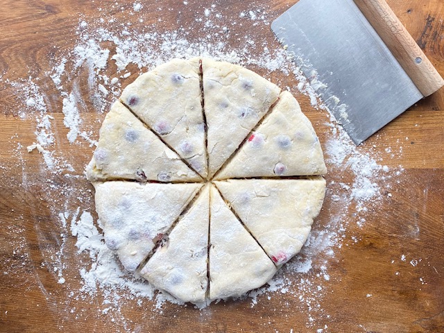 Gluten Free Cranberry Orange Scone Dough Cut Into Eight Triangles