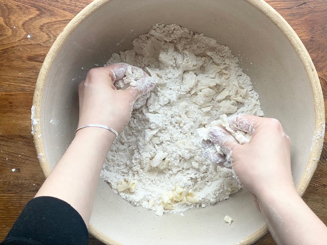 Hands Mixing Gluten Free Flour Mixture