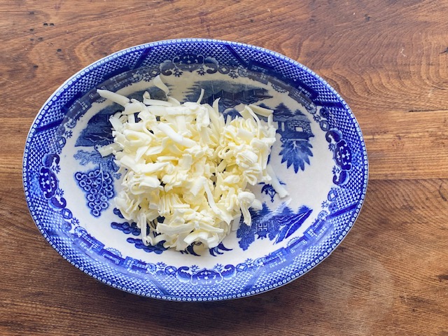 Grated Butter In Blue Bowl